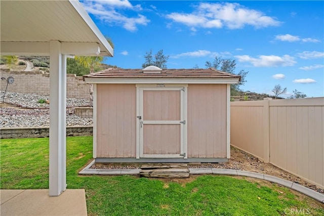 view of shed featuring a fenced backyard