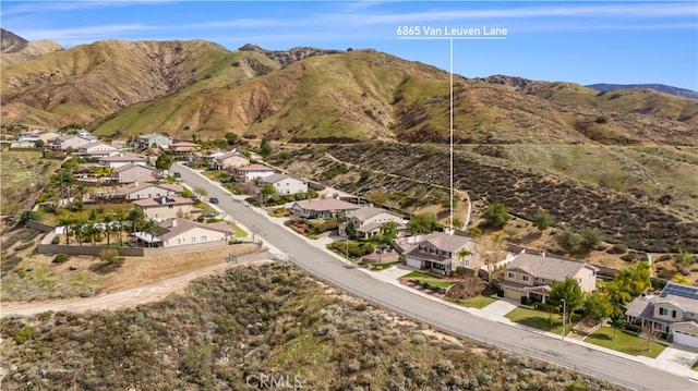 drone / aerial view featuring a residential view and a mountain view