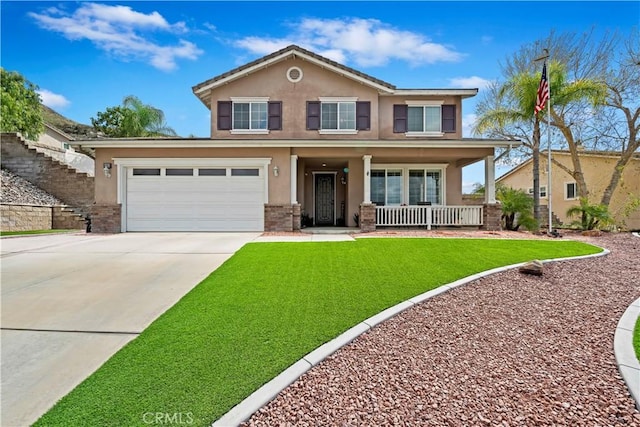 view of front of property featuring stucco siding, covered porch, concrete driveway, a front yard, and an attached garage