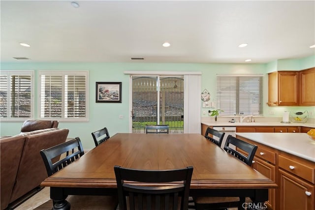 dining space featuring recessed lighting, visible vents, and a wealth of natural light