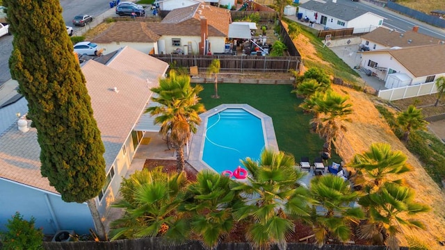 birds eye view of property with a residential view