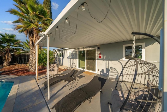 view of patio / terrace featuring fence