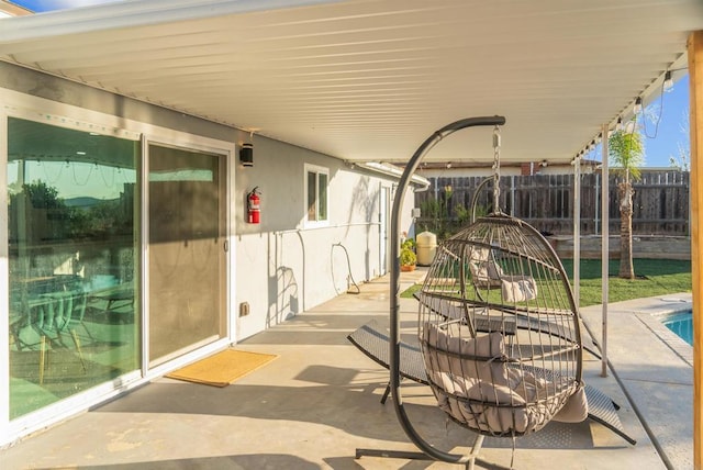 view of patio / terrace featuring outdoor dining area and fence