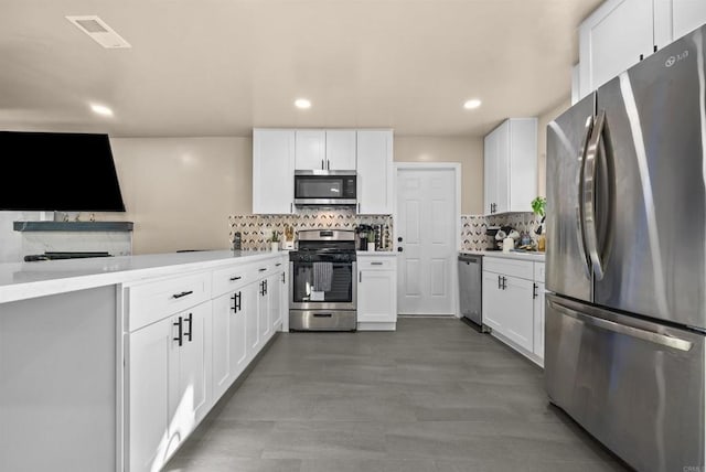 kitchen featuring stainless steel appliances, tasteful backsplash, light countertops, visible vents, and white cabinetry