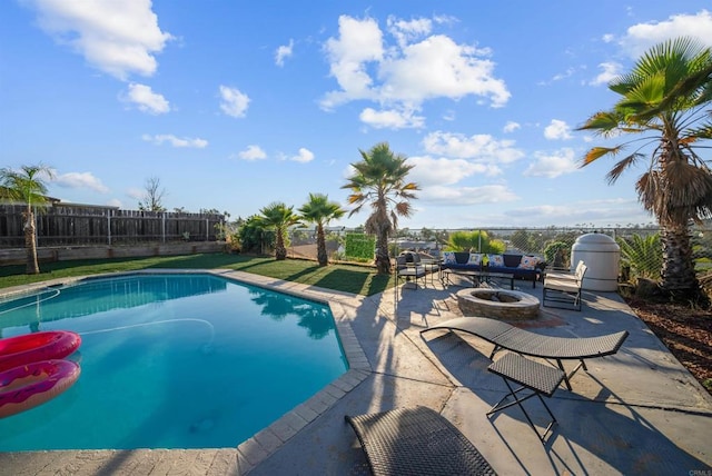 view of swimming pool with an outdoor fire pit, a patio area, fence, and a fenced in pool