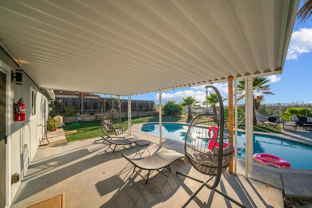 view of patio featuring a fenced in pool and a fenced backyard