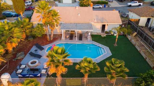 view of swimming pool with a patio, an outdoor fire pit, a fenced backyard, and a fenced in pool