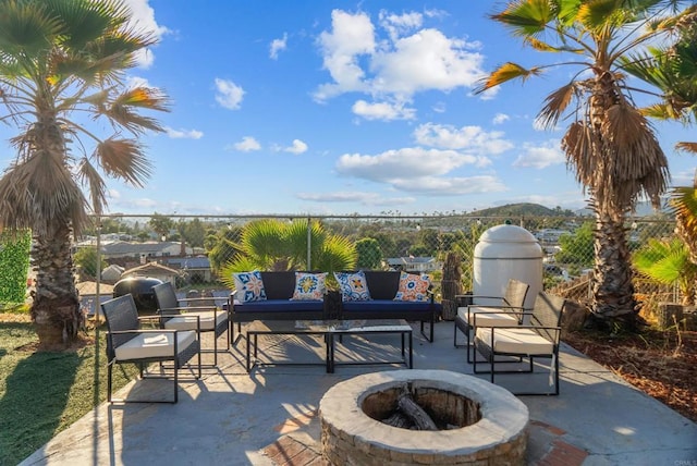 view of patio featuring an outdoor fire pit