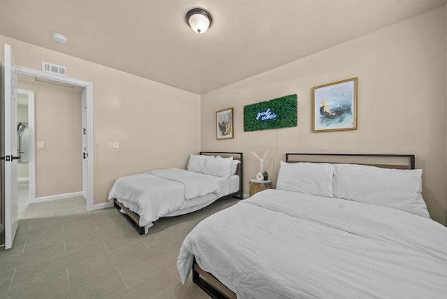 bedroom with visible vents and baseboards