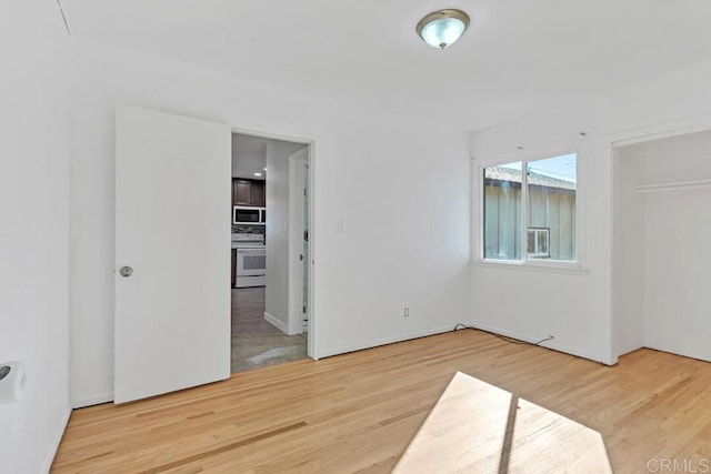 unfurnished bedroom featuring wood finished floors