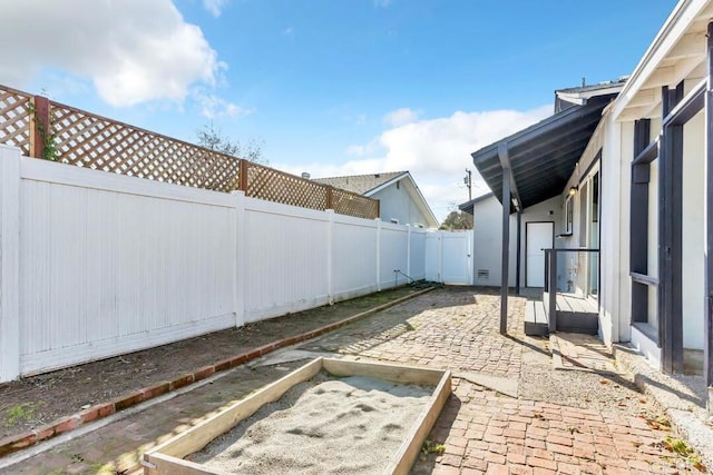 view of yard featuring a patio area and a fenced backyard