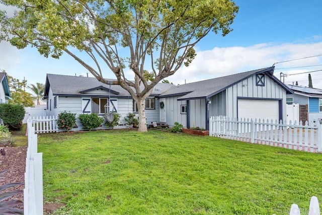 ranch-style house featuring an attached garage, board and batten siding, a front lawn, and fence