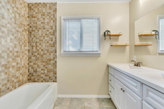 bathroom with baseboards, vanity, and tile patterned flooring