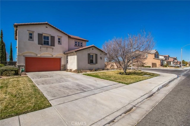 mediterranean / spanish home with stucco siding, driveway, a tile roof, fence, and an attached garage