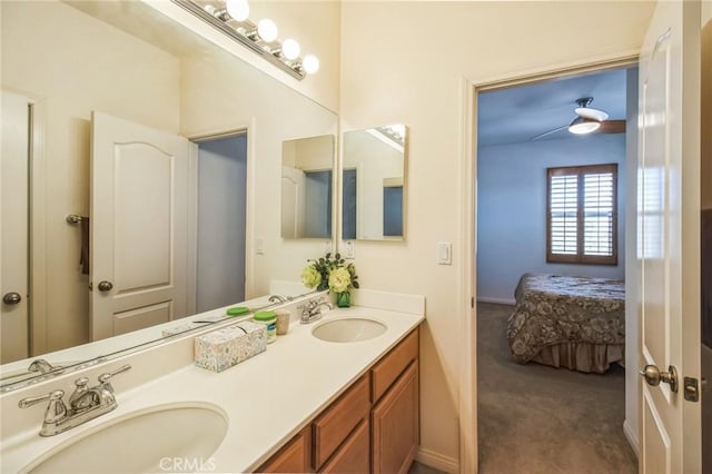 full bathroom with a sink, double vanity, and ensuite bathroom