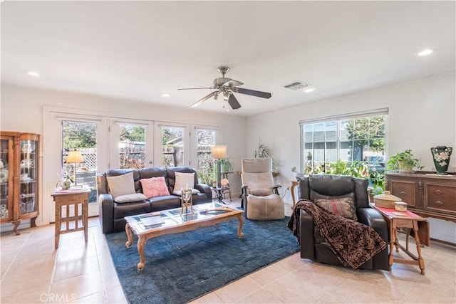 living area featuring a ceiling fan, recessed lighting, visible vents, and light tile patterned floors