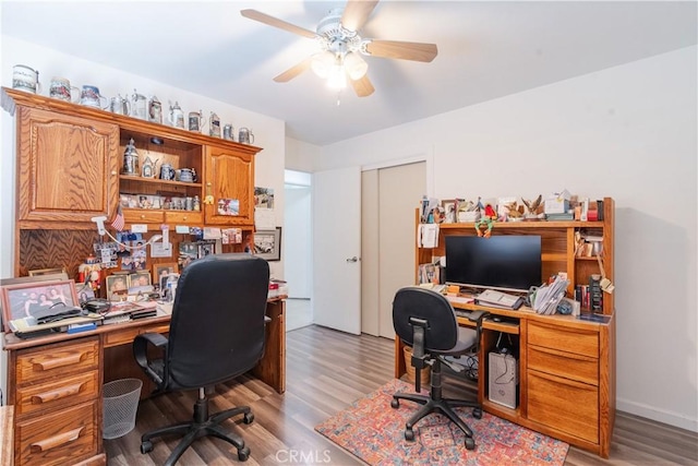 office featuring light wood finished floors and a ceiling fan