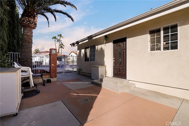 view of patio featuring fence