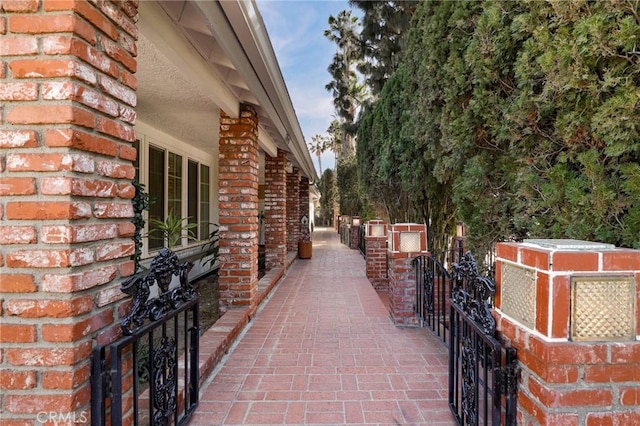 view of patio with a gate and fence