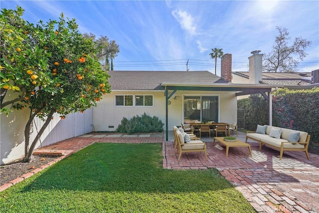 back of house with a patio, stucco siding, a lawn, an outdoor hangout area, and fence