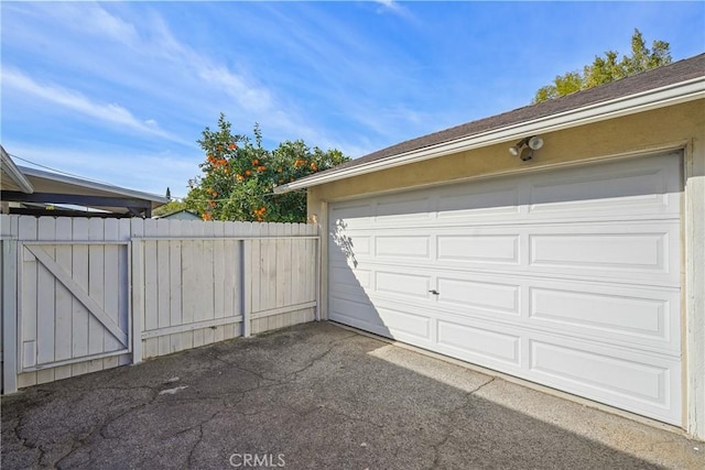 garage with fence