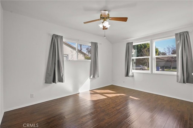 unfurnished room featuring a ceiling fan, baseboards, and hardwood / wood-style flooring