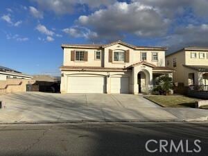 view of front of property with an attached garage and driveway