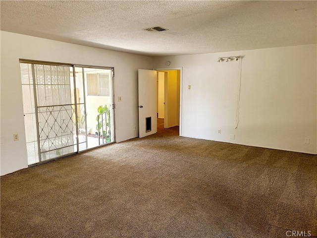 1311 E Olive St, Colton, CA 92324 - carpeted spare room with visible vents and a textured ceiling