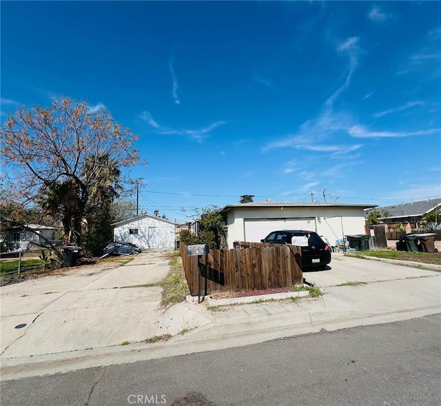 1311 E Olive St, Colton, CA 92324 - view of front of house featuring fence and concrete driveway