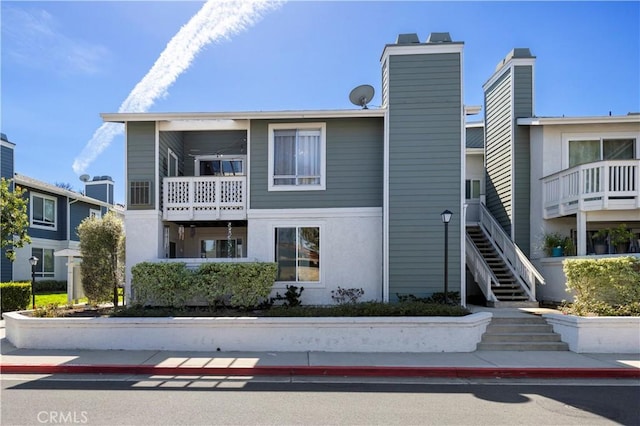 view of property featuring stairway