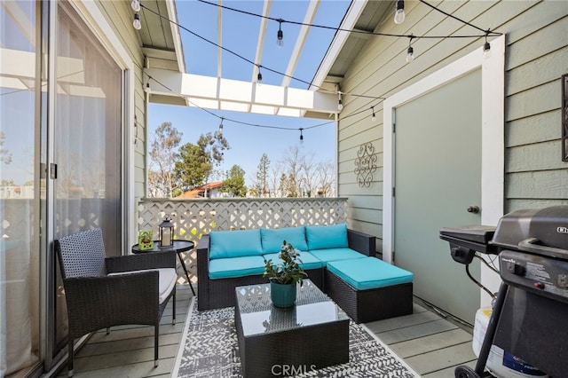 wooden terrace featuring grilling area and outdoor lounge area