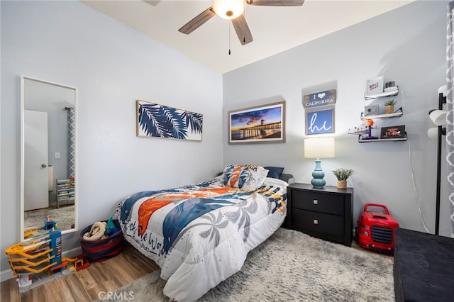 bedroom featuring a ceiling fan and wood finished floors