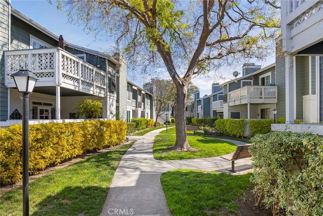 surrounding community featuring a residential view and a lawn