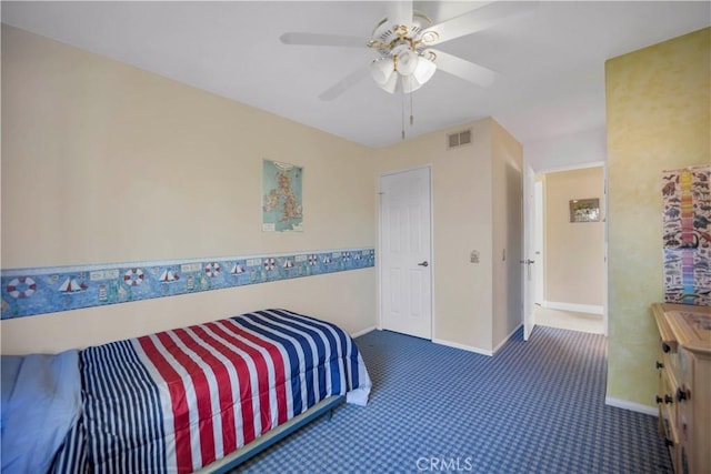 carpeted bedroom featuring baseboards, visible vents, and a ceiling fan