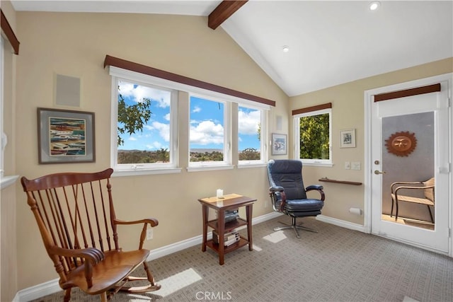 living area with light colored carpet, vaulted ceiling with beams, and baseboards