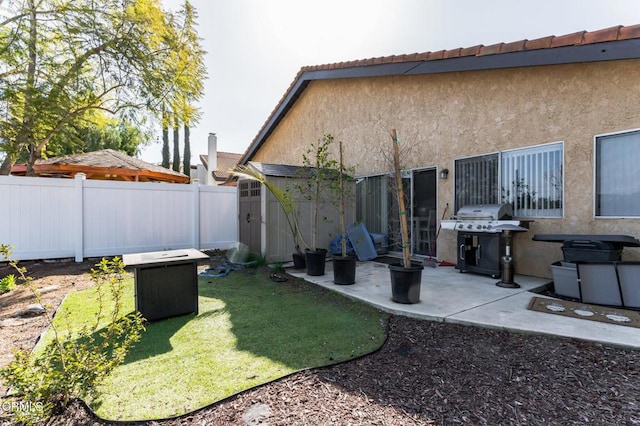 exterior space with a patio and fence