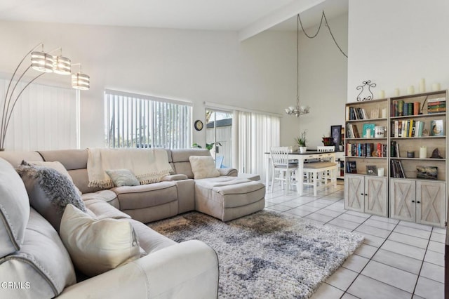 living area featuring beam ceiling, a notable chandelier, light tile patterned flooring, and high vaulted ceiling