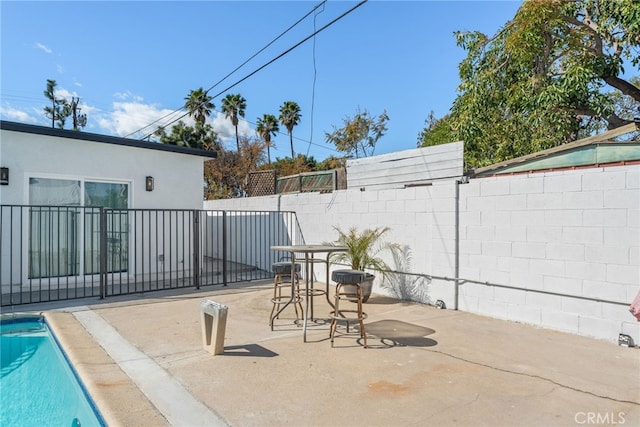 view of patio / terrace featuring fence and a fenced in pool