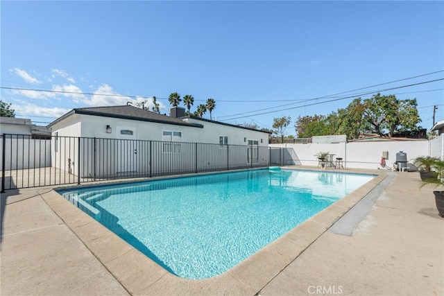 view of swimming pool featuring central air condition unit, a patio area, a fenced backyard, and a fenced in pool