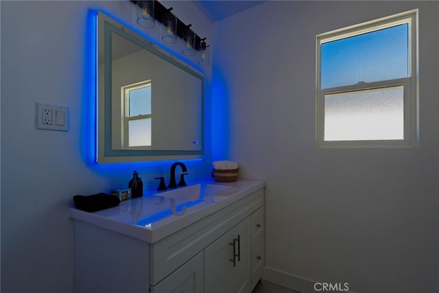 bathroom featuring vanity and baseboards