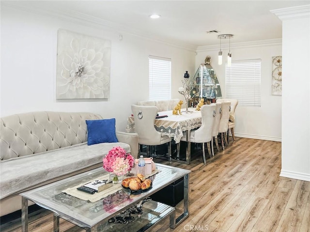 dining space featuring recessed lighting, wood finished floors, visible vents, baseboards, and ornamental molding