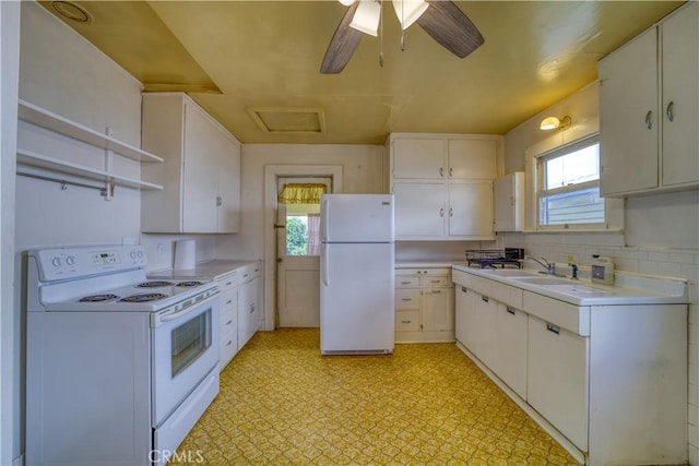 kitchen with white appliances, white cabinets, light countertops, light floors, and open shelves