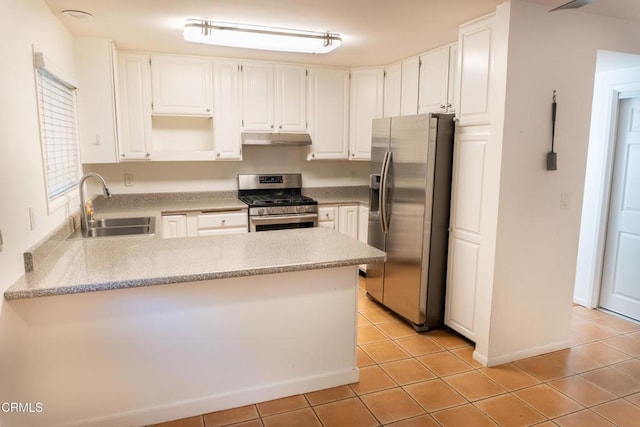 kitchen with stainless steel appliances, light tile patterned flooring, a sink, a peninsula, and under cabinet range hood