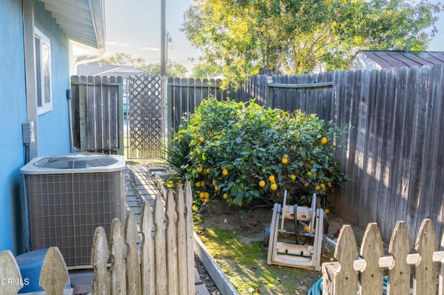 exterior details featuring cooling unit and fence