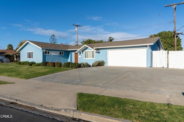 single story home with a garage, driveway, fence, and a front lawn