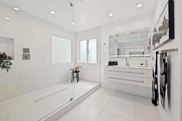 bathroom featuring recessed lighting, vanity, walk in shower, and tile patterned floors