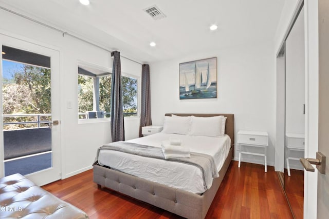 bedroom featuring recessed lighting, wood finished floors, visible vents, access to exterior, and baseboards