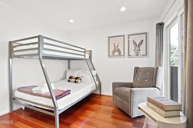 bedroom with recessed lighting, baseboards, and wood finished floors