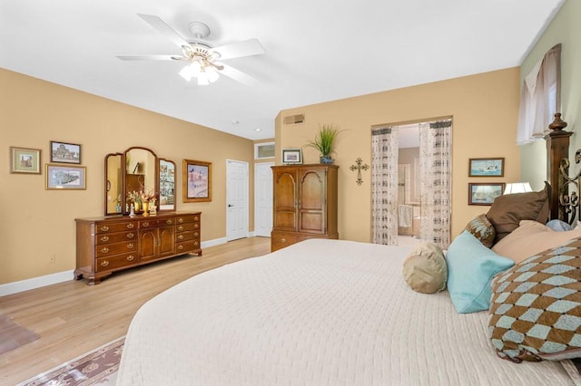 bedroom featuring light wood-style floors, visible vents, baseboards, and a ceiling fan