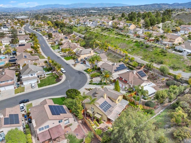 drone / aerial view with a residential view and a mountain view